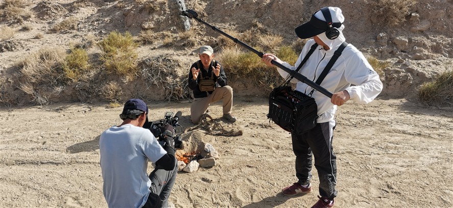 Wuxi crew members discussing a shoot plan